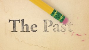 A pencil and paper with the word " past " written on it.
