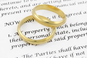 Two gold wedding rings on top of a paper.